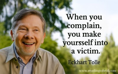Eckhart Tolle smiling outdoors with a quote about being a victim
