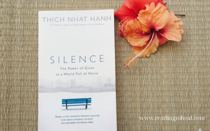 Silence The Power of Quiet in a World Full of Noise by Thich Nhat Hanh with a hibiscus flower – mindfulness book about inner peace